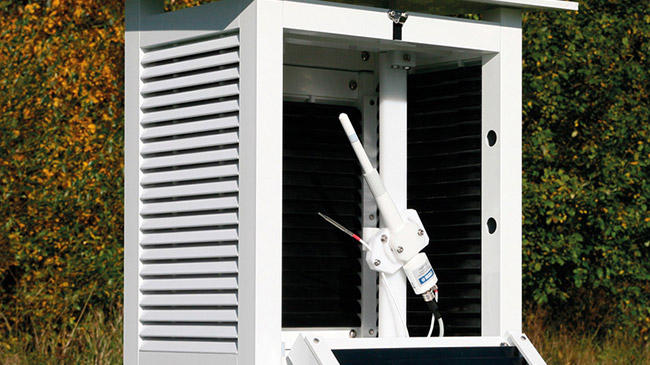 A Vaisala HMP155 temperature and humidity probe being used outside in a weather station