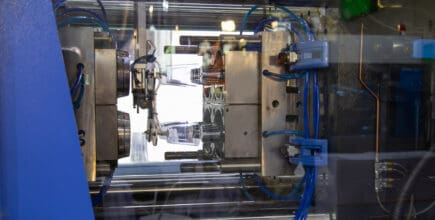 An injection molding press machine