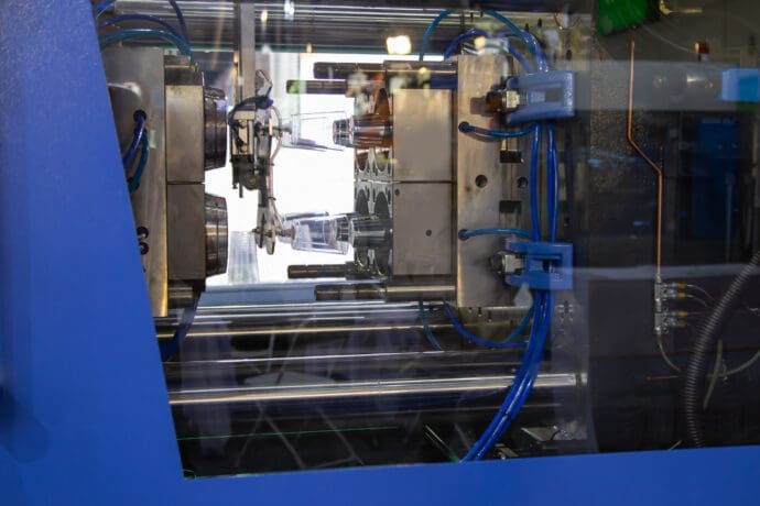 An injection molding press machine