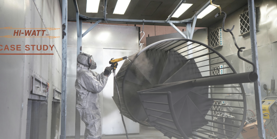 A person is spraying a coating on metal